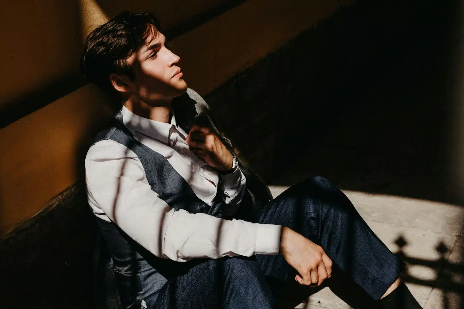 A man leaning on a wall.