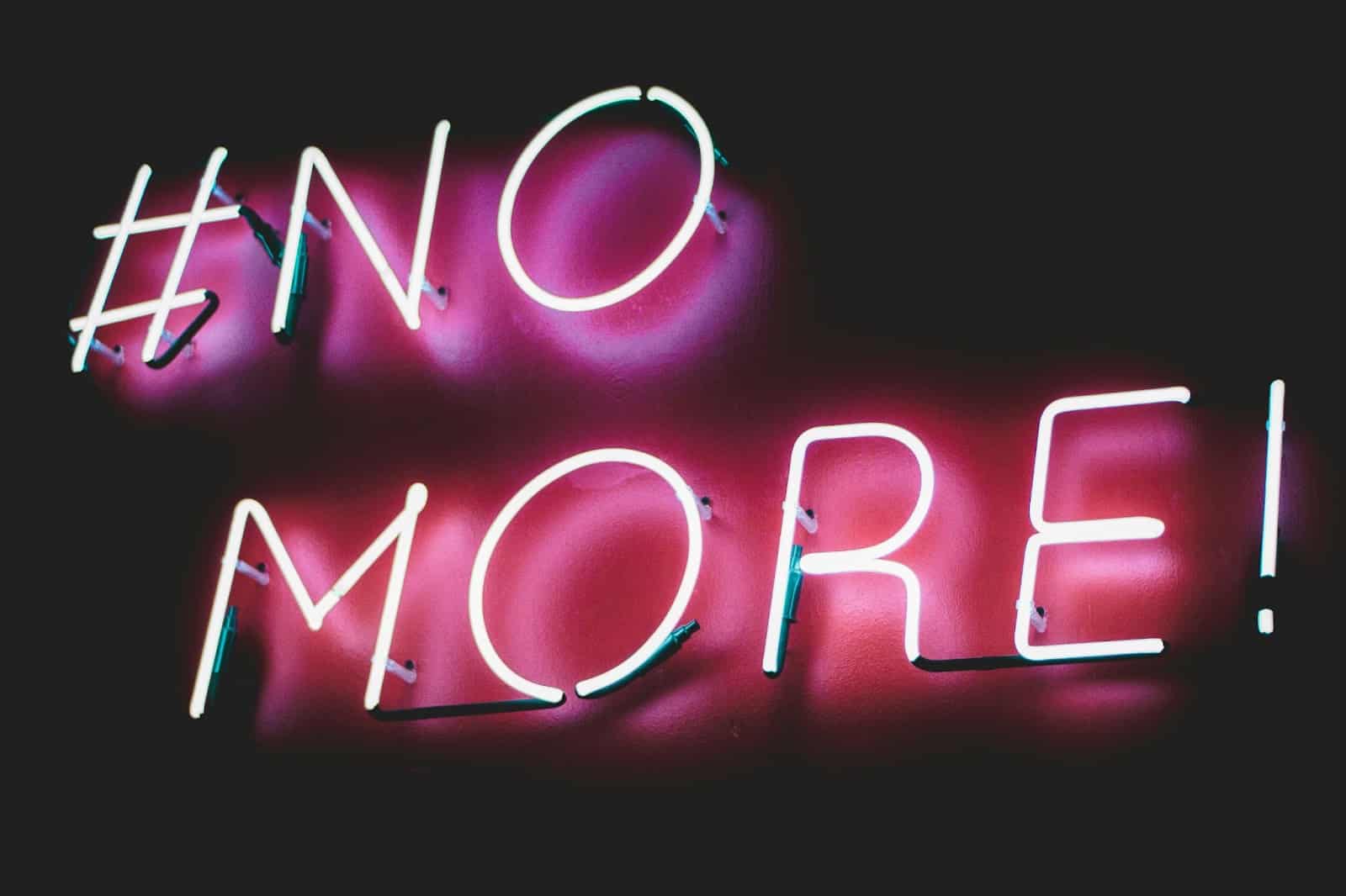 A picture of a neon light sign that says no more.