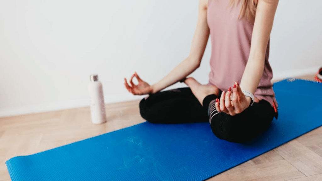 A woman doing yoga by herself