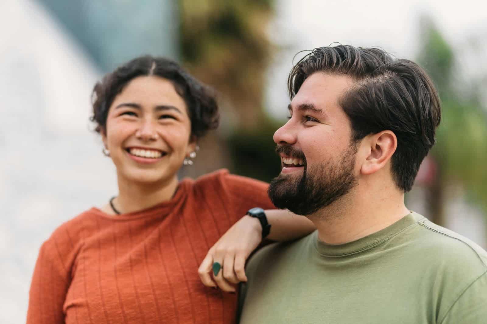 A man and woman smiling.