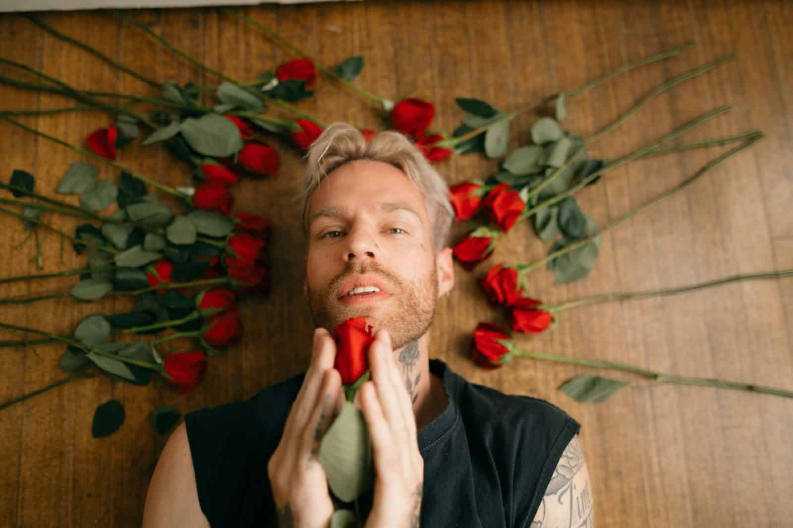 A man holding roses.