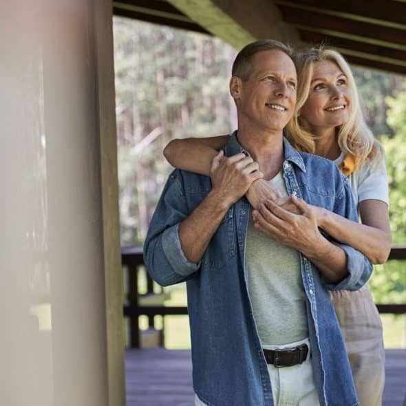 A married couple enjoying the morning view.
