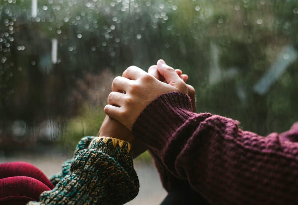 A man holding a woman’s hand