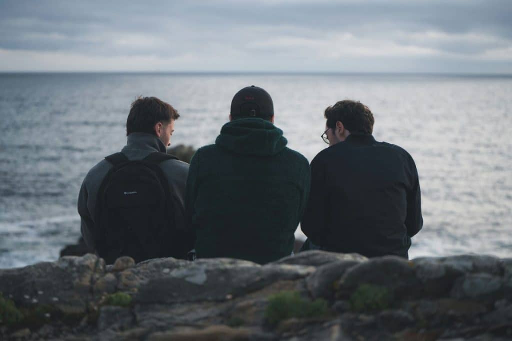 Three men talking