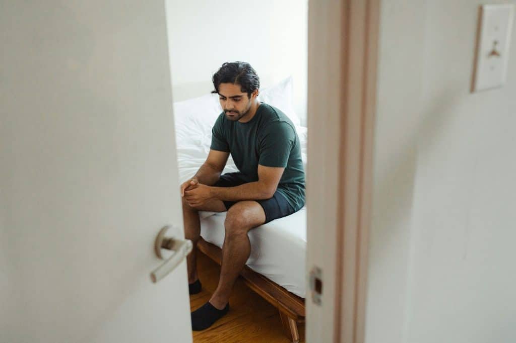 A man staring and looking sad