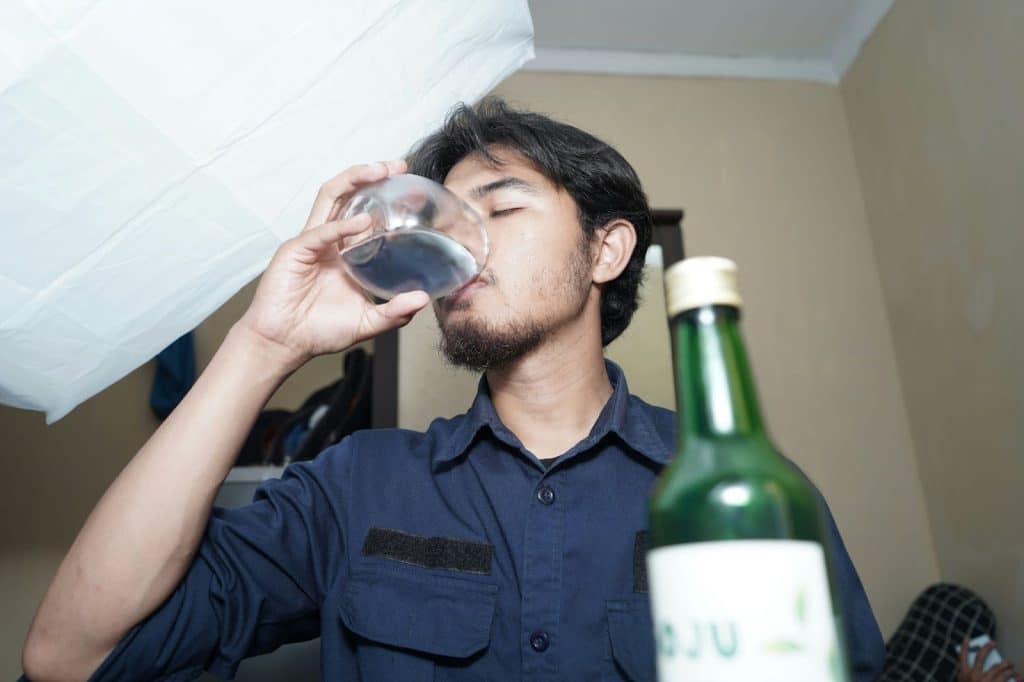 A man dinking soju