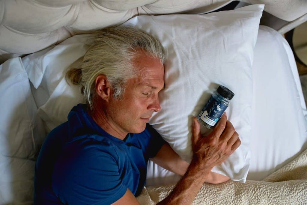 A man with melatonin beside him