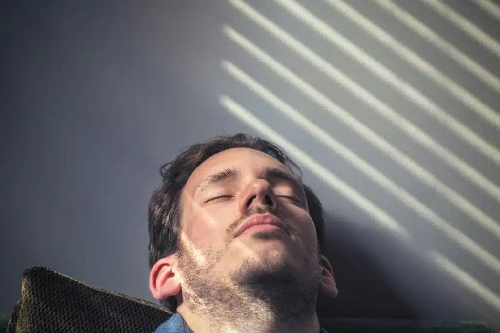 A man taking a nap during the day