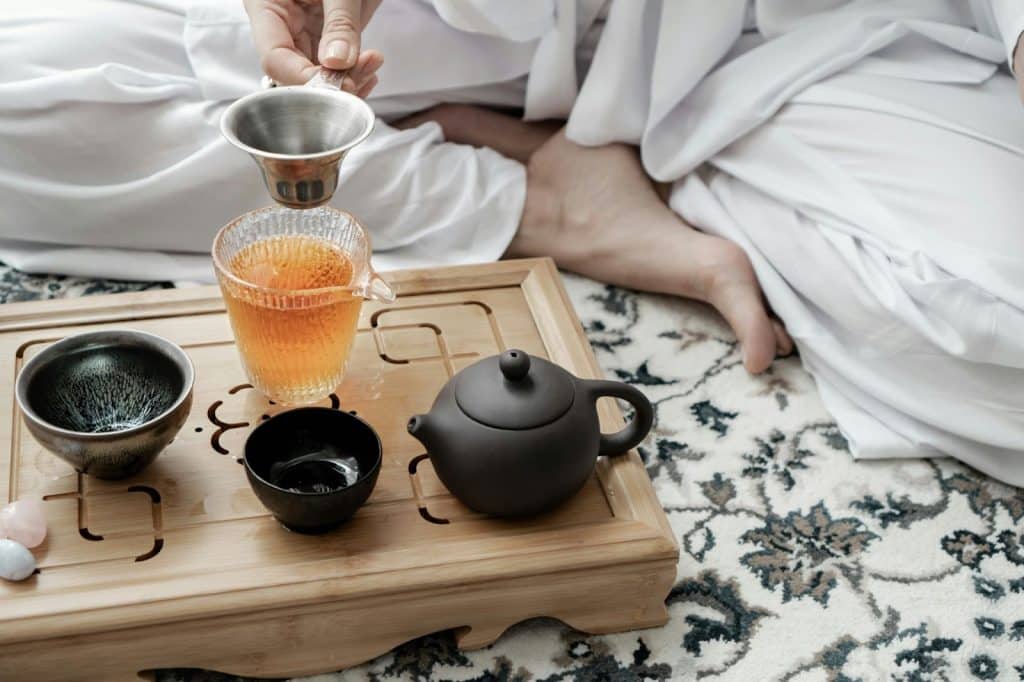 A man drinking a herbal tea