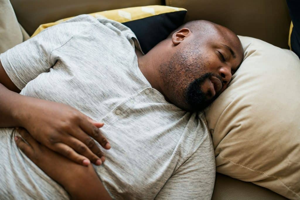 A man sleeping at the bed