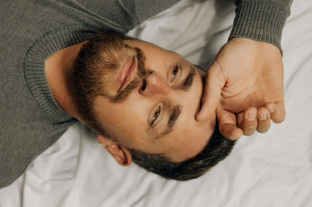 A man forced to sleep
