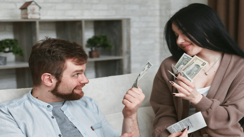 A couple counting cash.