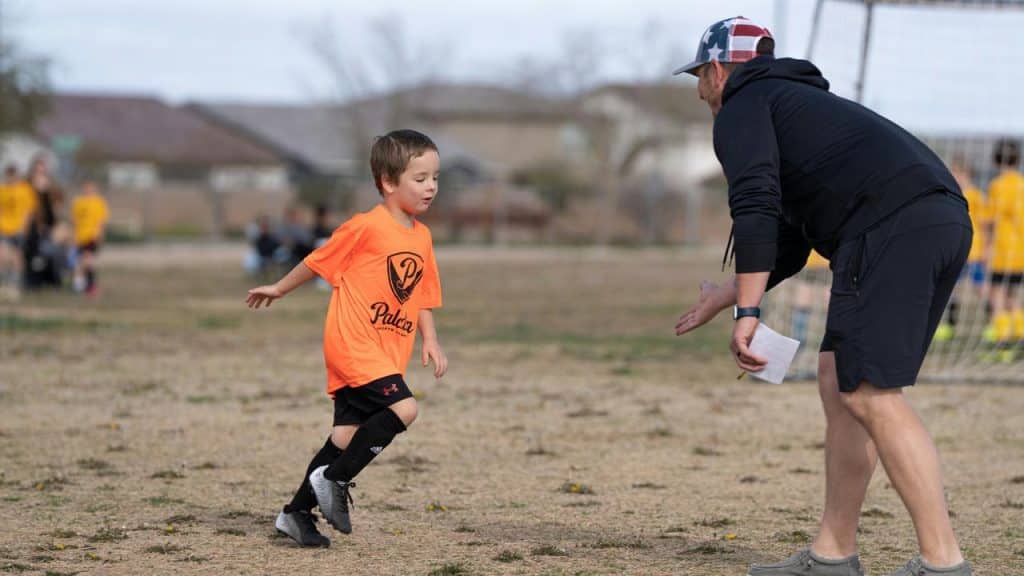 A youth soccer game in action.
