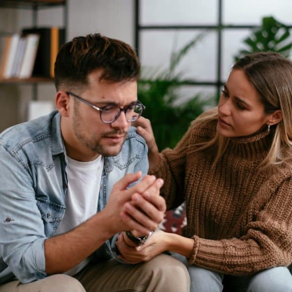 A woman talking to a man.