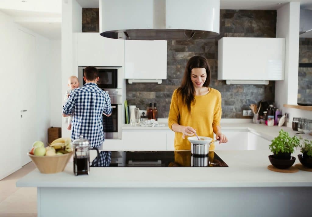 A husband and wife at the kitchen.
