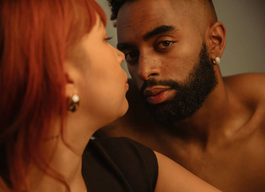 A woman looking at the man.
