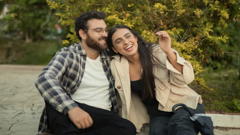 A happy couple at a park.