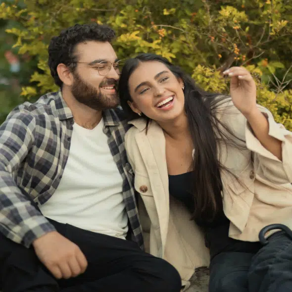 A happy couple at a park.