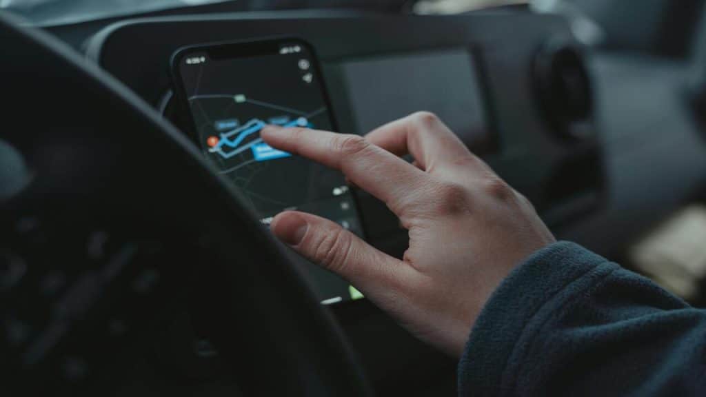 A man looking at a map on his phone.