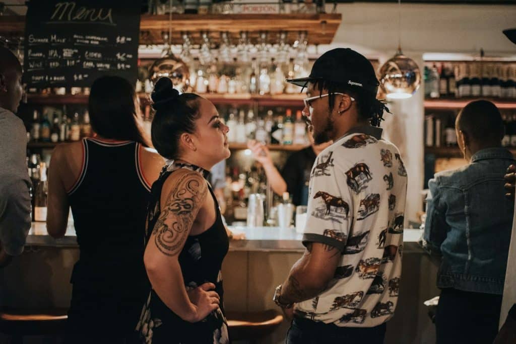 A woman looking at the man.