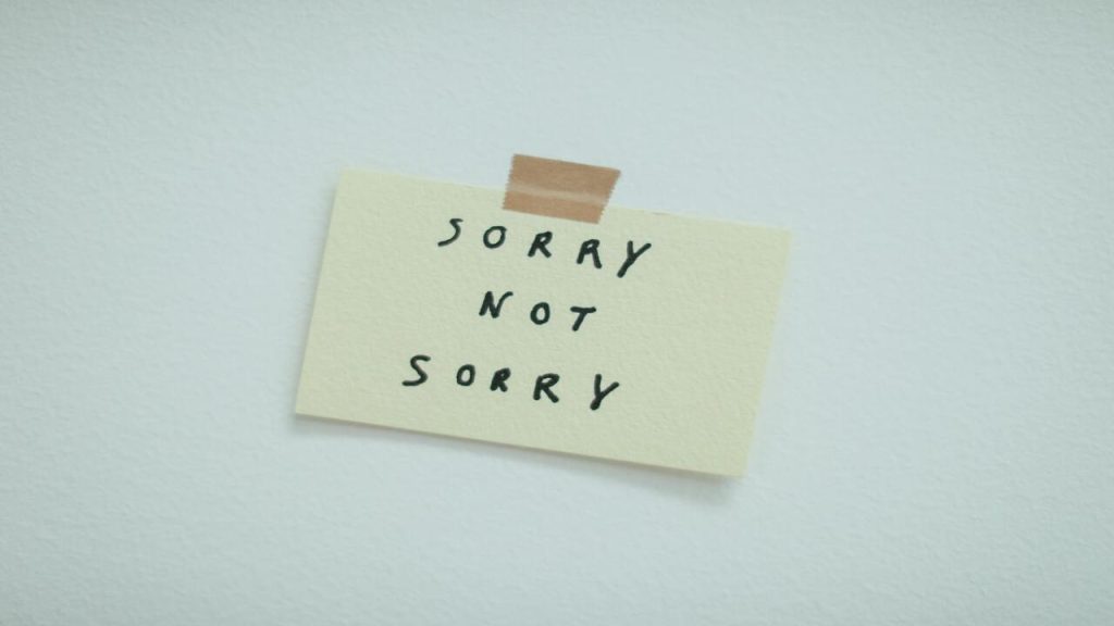 A paper saying “sorry not sorry”.