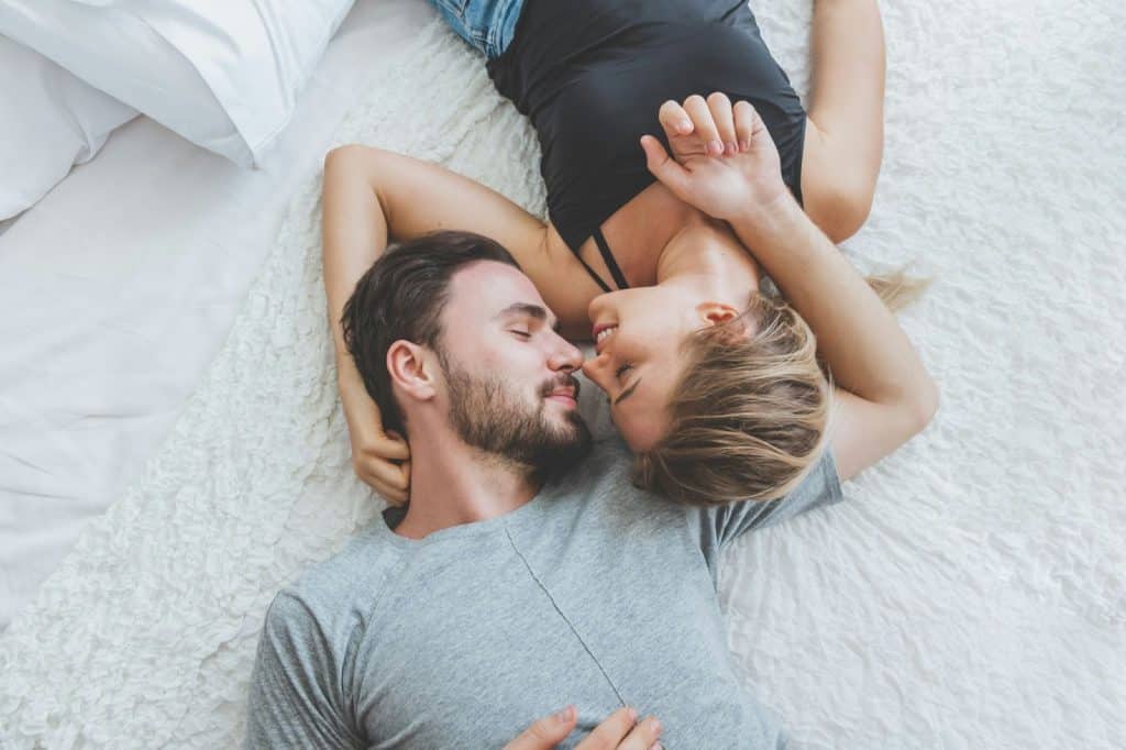 A woman asking a man.