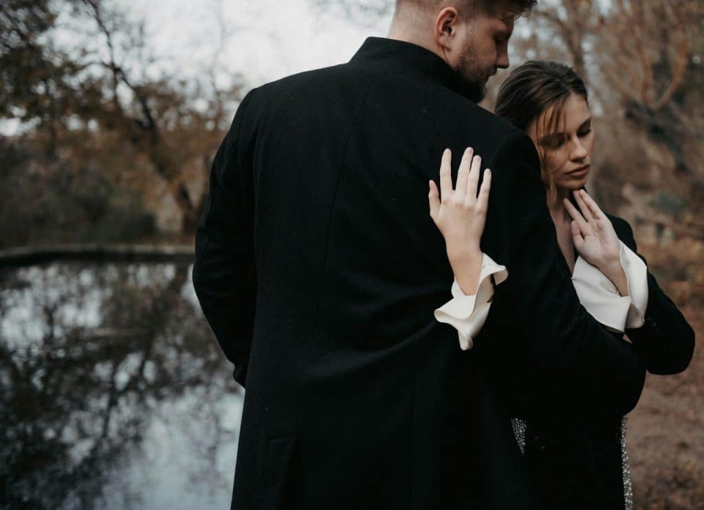 A woman leaning her head to a man.