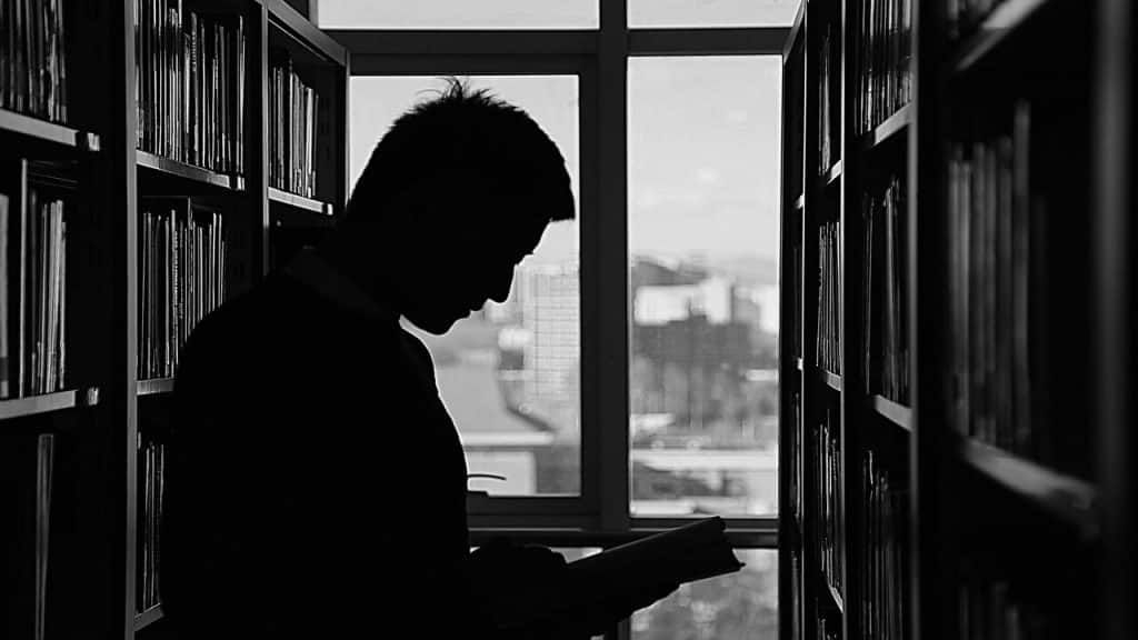 A man reading at the library