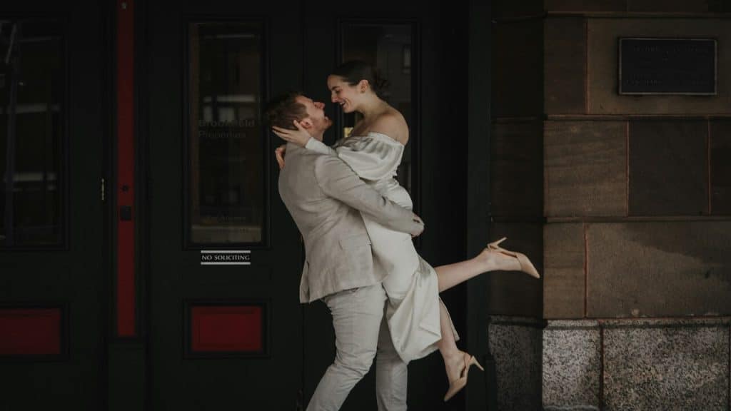 A couple hugging by the door