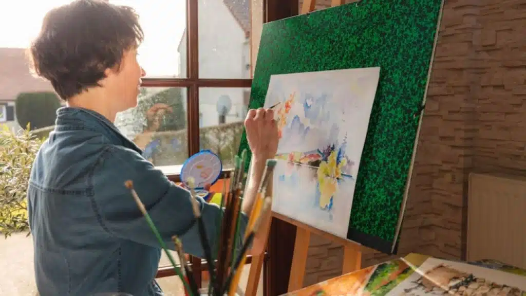 Woman spending time on a hobby while man watches from a distance