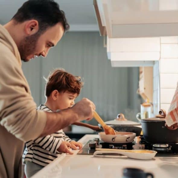 House husband preparing dinner with a calm and proud expression