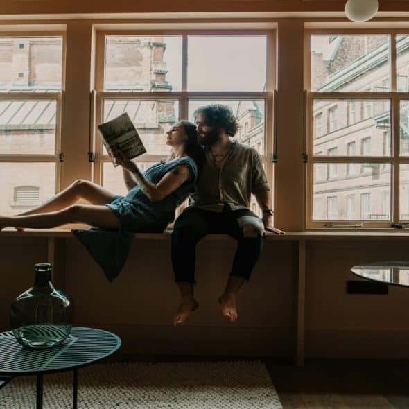 A couple hanging out at home.
