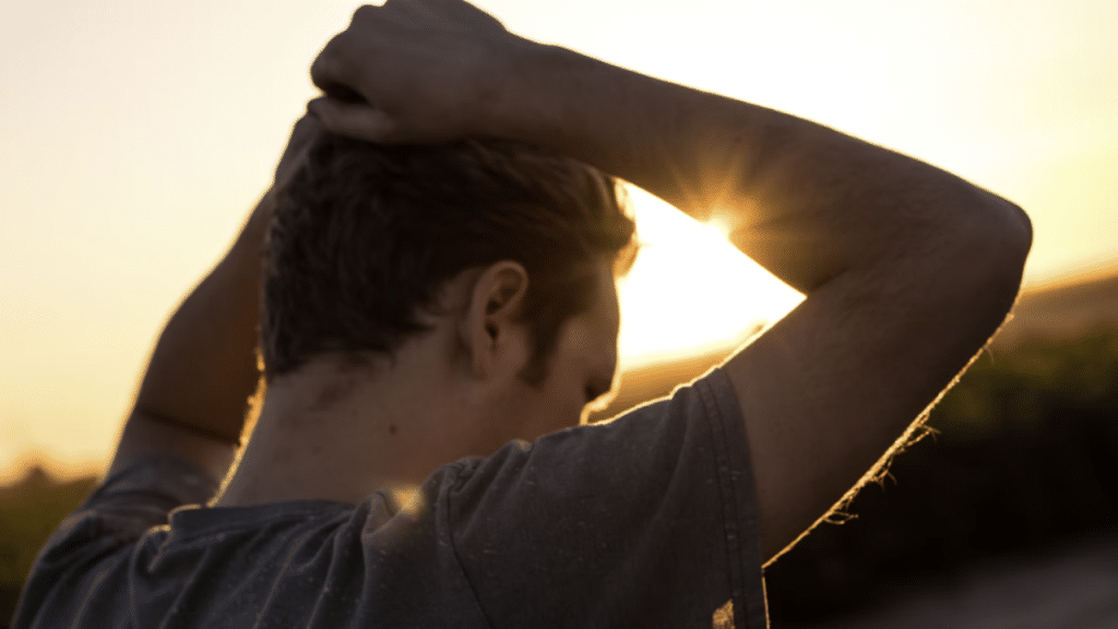 A man thinking hard at dusk.