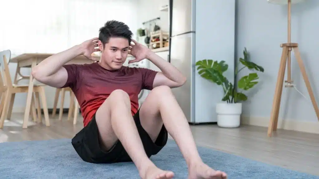 House husband maintaining fitness with a home workout