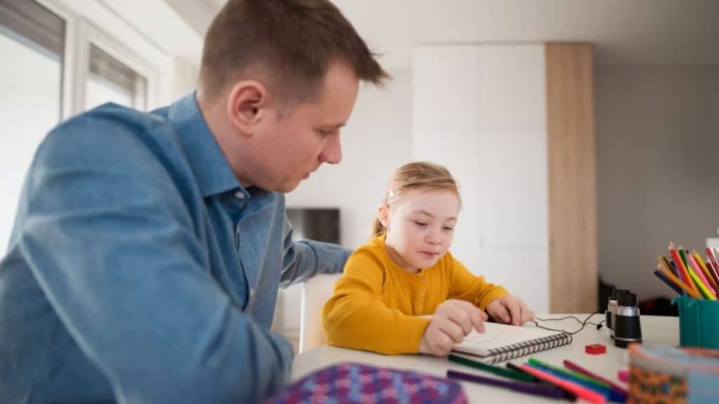 Patient father guiding his child through schoolwork