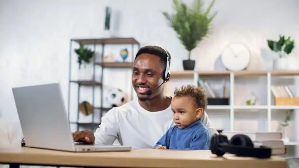 House husband managing work and parenting in a home setting