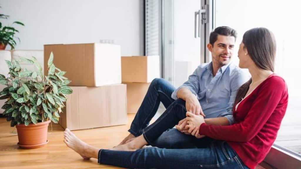 Man and woman in calm conversation at home.