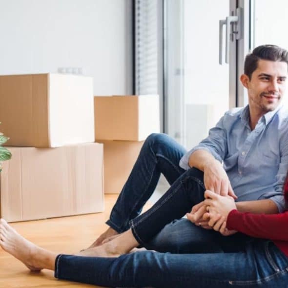 Man and woman in calm conversation at home.