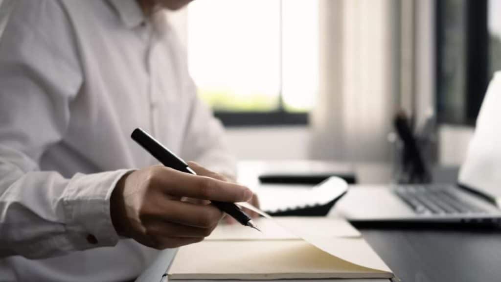 Man composing a heartfelt message or note to partner.