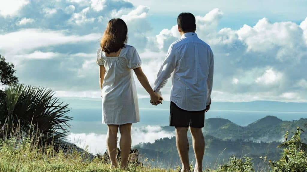 Man and woman walking peacefully together, symbolizing trust.