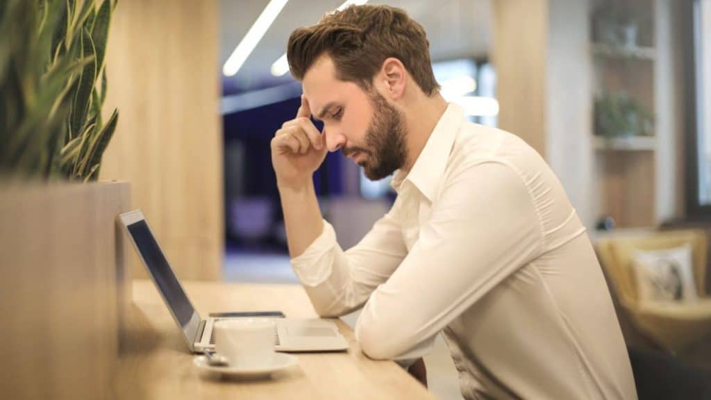 Thoughtful man reflecting on personal habits in a relationship setting