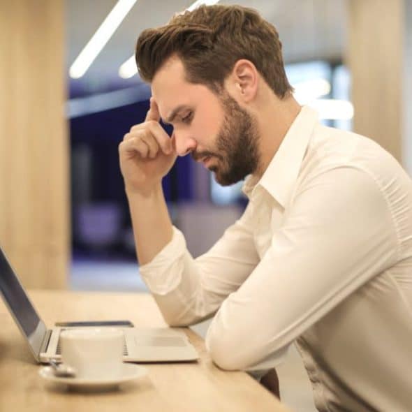 Thoughtful man reflecting on personal habits in a relationship setting