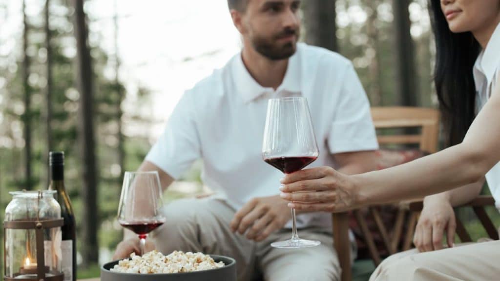 Man dominating conversation, interrupting partner during dinner