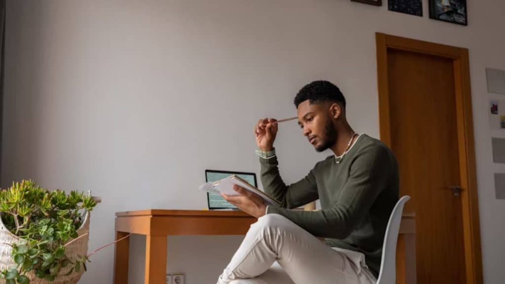 Man reflecting on relationship behavior through journaling