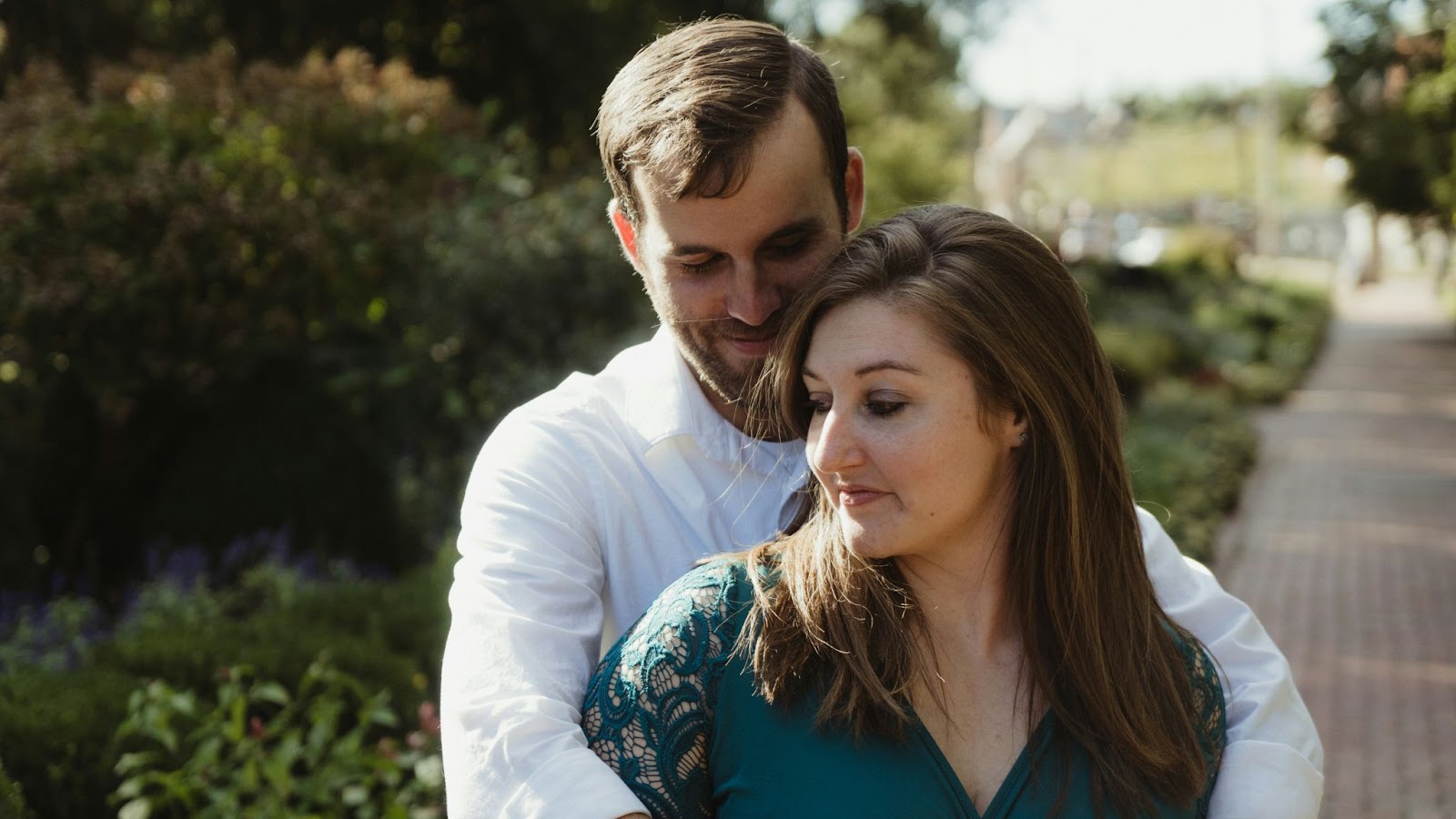 A man hugging a woman.