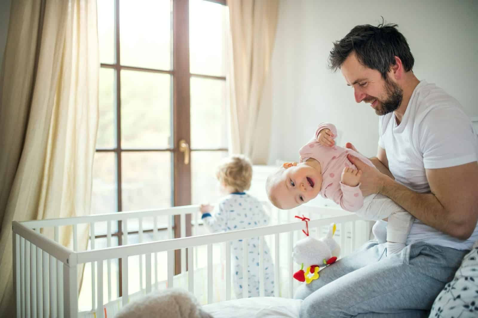 A man holding a baby.