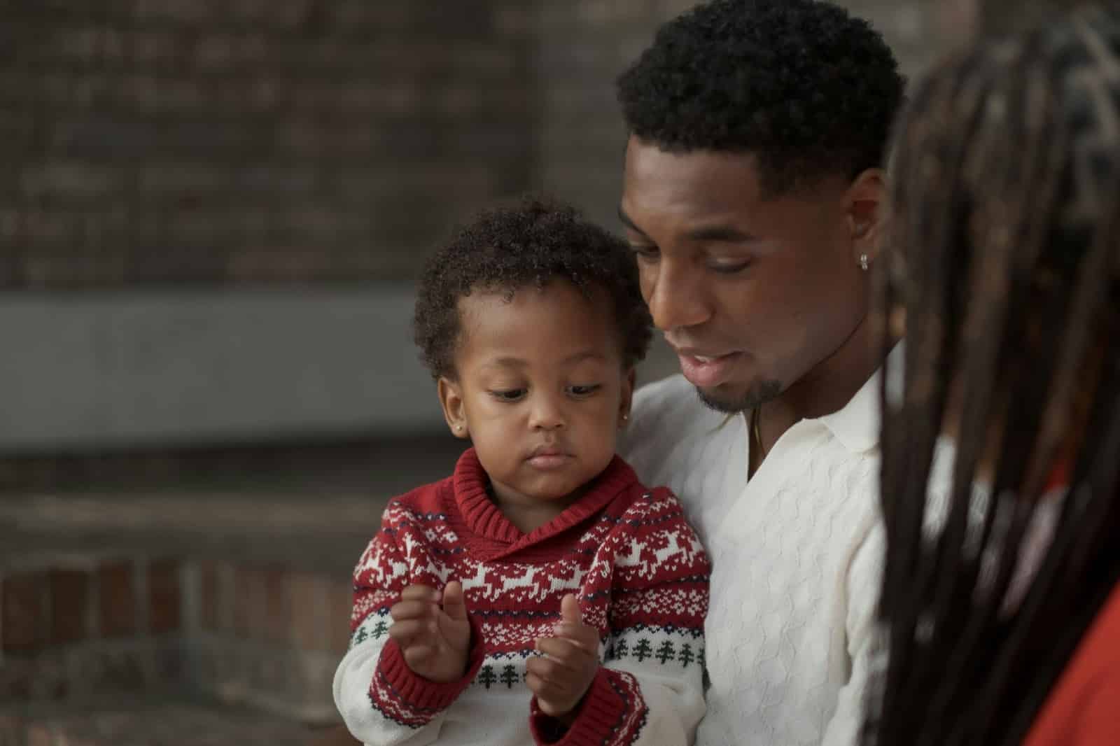 A man talking to his son.
