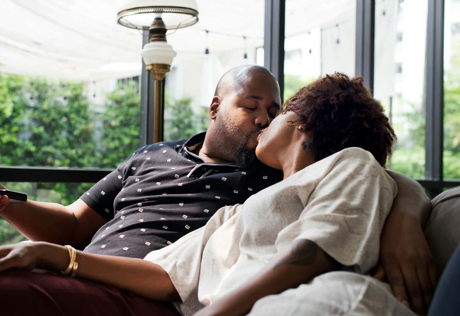 A man kissing a woman.