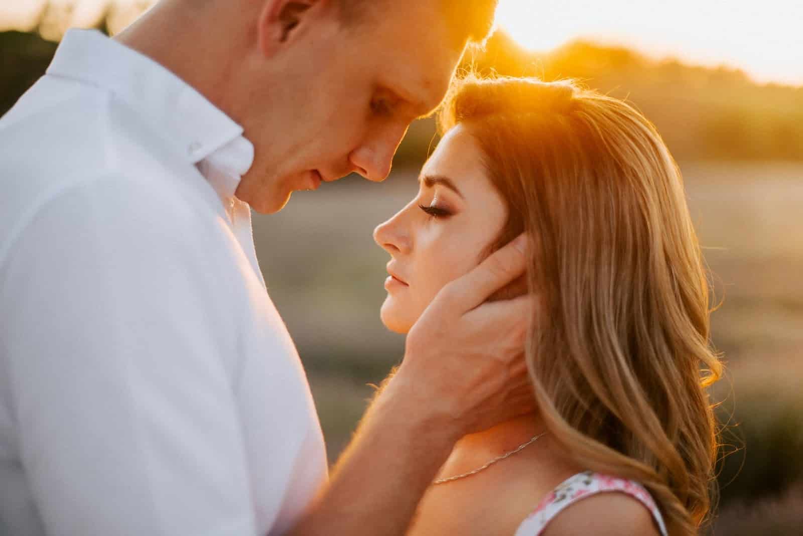 A man and woman having a romantic moment.