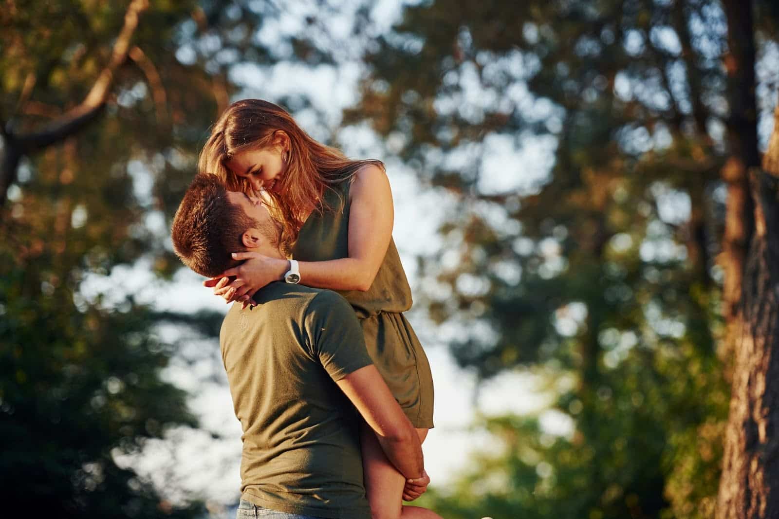 A man carrying a woman.